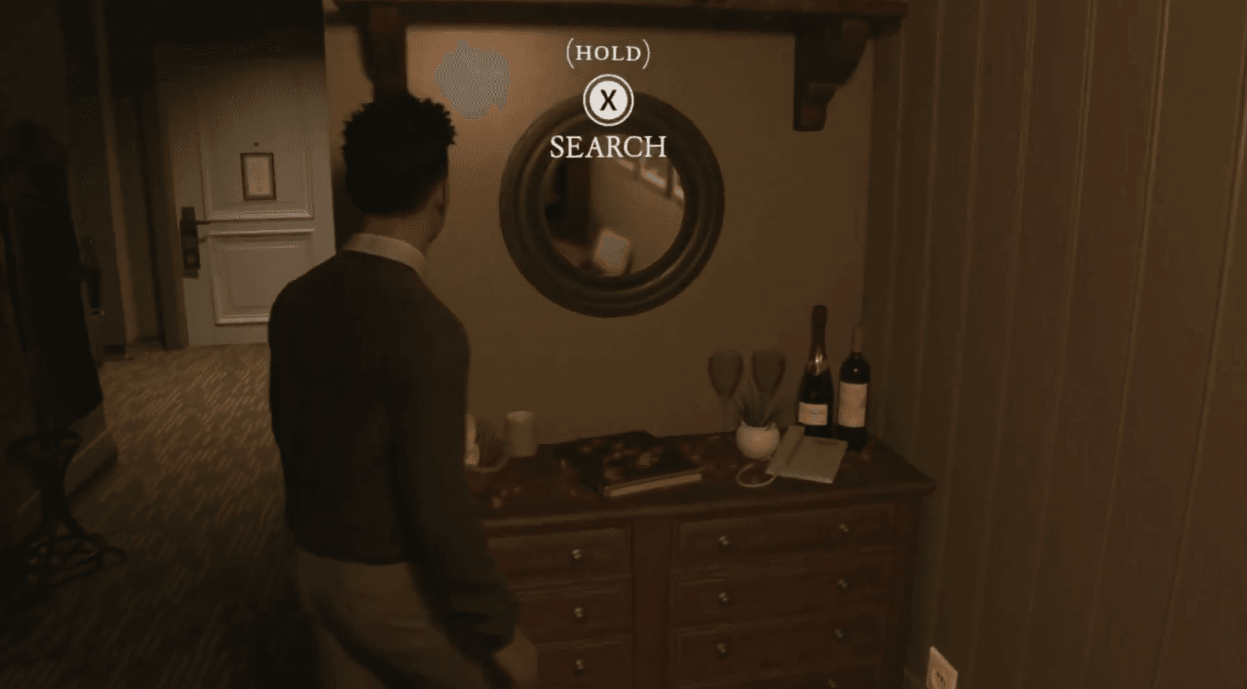 Search prompt above the round mirror and cabinet beneath a wooden shelf in the hotel bedroom.